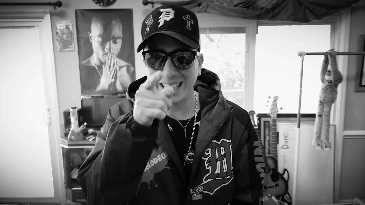 Horus pointing at the camera in black and white with a heavy vignette
